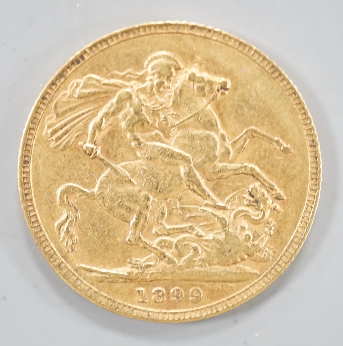 A Victoria 1899 gold sovereign.